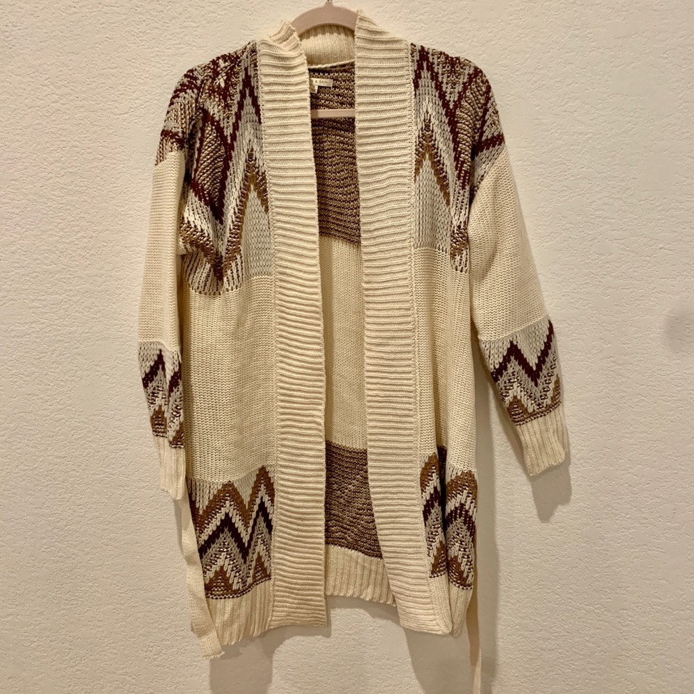 Cream sweater cardigan w/ brown neutrals chevron pattern. W/ tie.